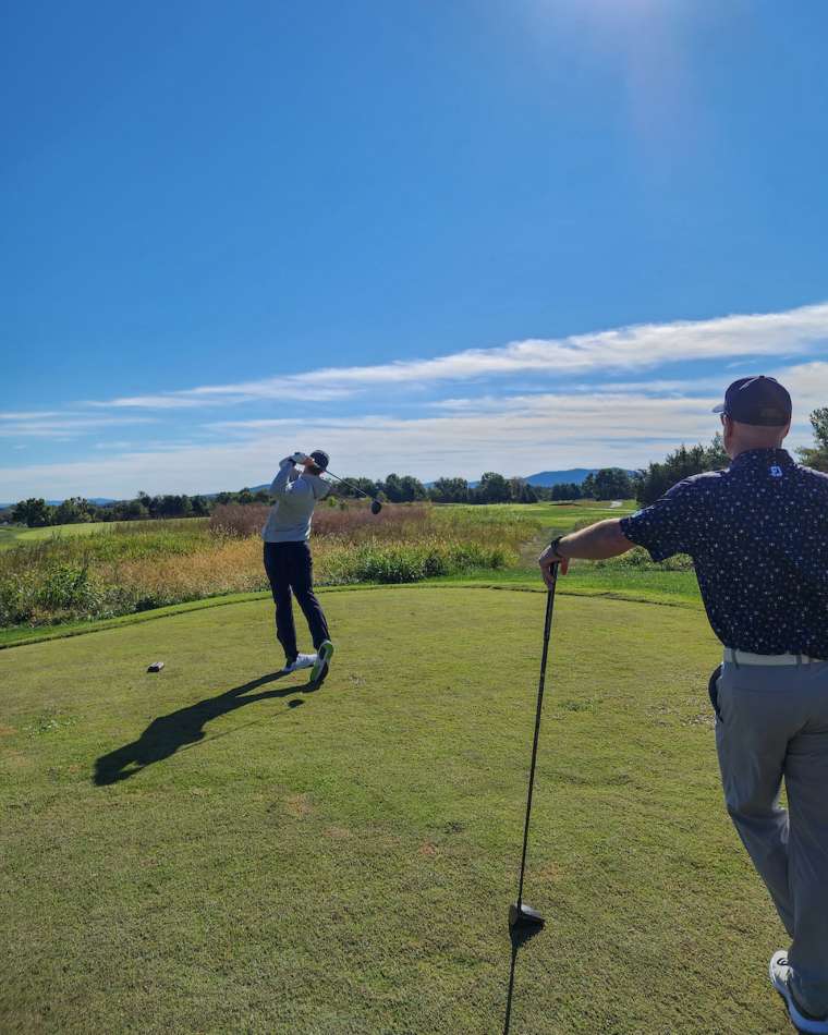 Golfer Making a Perfect Shot on Manicured Green Field in Crozet, VA