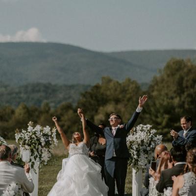 Newlyweds share a joyful moment during their wedding ceremony in Crozet, VA