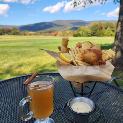 A glass of tea and a plate of breakfast items displayed on a table in Crozet, VA